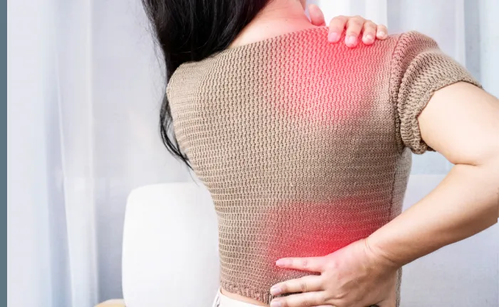 Patient with highlighted pain areas looking for relief at Chiropractor in Tarpon Springs, FL