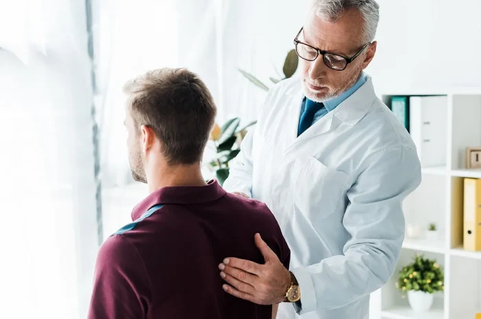 Chiropractor tarpon springs helping client with tightness in thigh